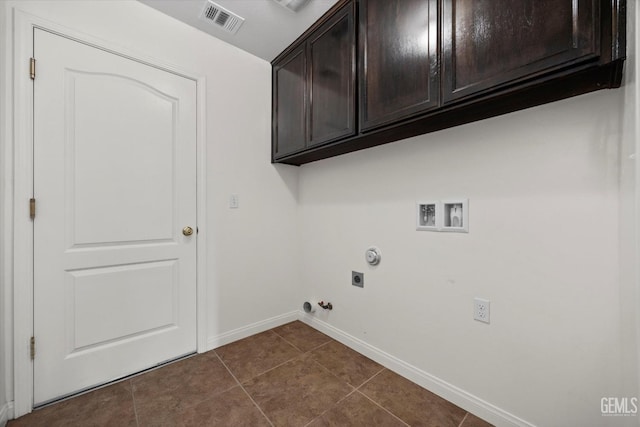 laundry area featuring visible vents, hookup for a gas dryer, washer hookup, cabinet space, and hookup for an electric dryer