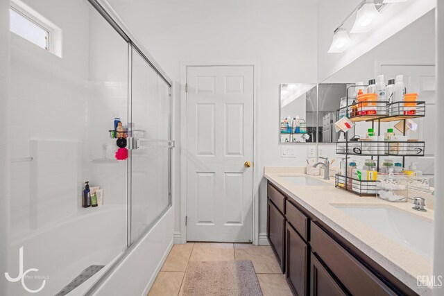408 Isla Bonita St, Bakersfield, CA 93307 - bathroom with tile patterned flooring, enclosed tub / shower combo, and double vanity