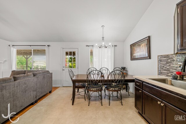 408 Isla Bonita St, Bakersfield, CA 93307 - dining room with a chandelier and lofted ceiling