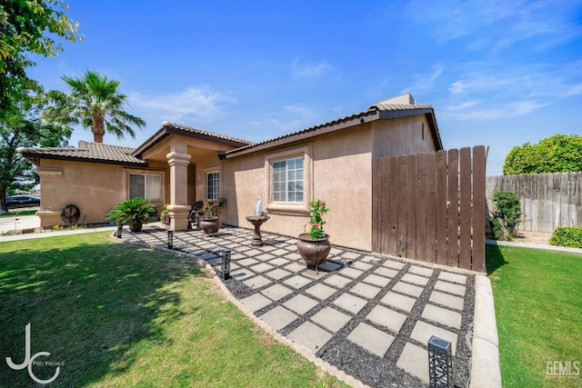 408 Isla Bonita St, Bakersfield, CA 93307 - view of front of house with stucco siding, a patio area, and a tiled roof