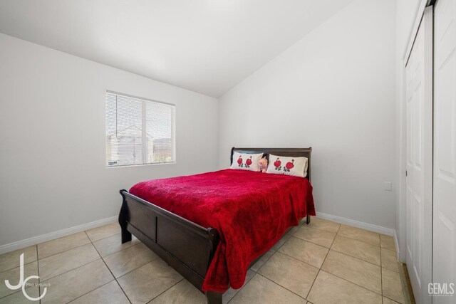 408 Isla Bonita St, Bakersfield, CA 93307 - bedroom with a closet, light tile patterned flooring, and lofted ceiling