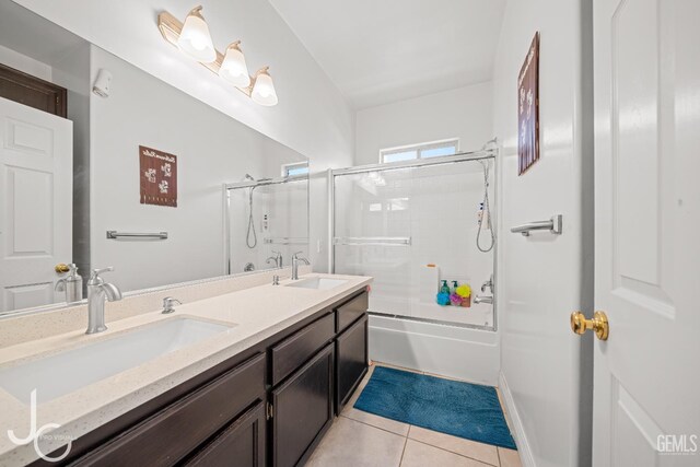 408 Isla Bonita St, Bakersfield, CA 93307 - full bath with tile patterned floors, double vanity, and combined bath / shower with glass door