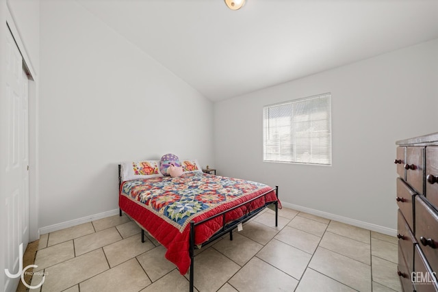 408 Isla Bonita St, Bakersfield, CA 93307 - tiled bedroom featuring vaulted ceiling and a closet
