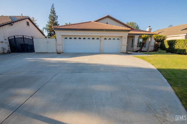 view of front of house with a front lawn and a garage