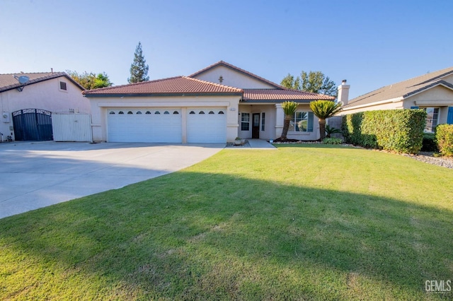 view of front of home featuring a garage and a front lawn