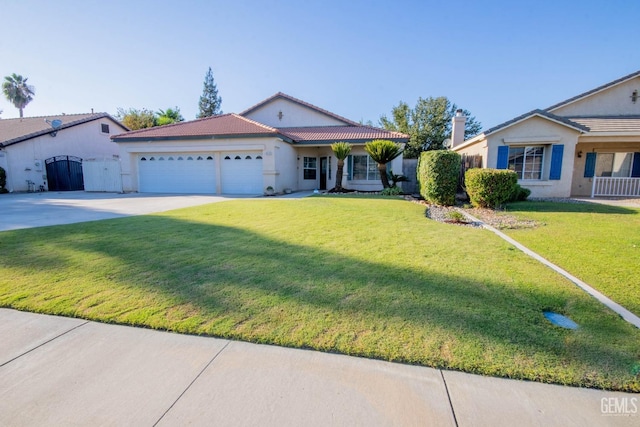 ranch-style house featuring a garage and a front lawn