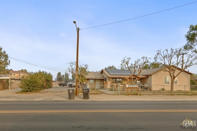 view of front of property with solar panels