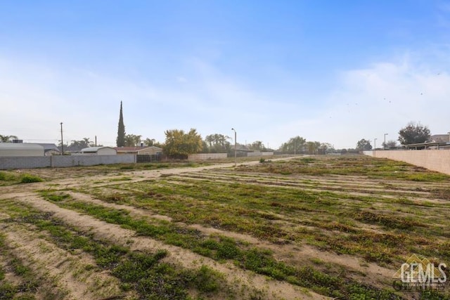 view of yard with a rural view