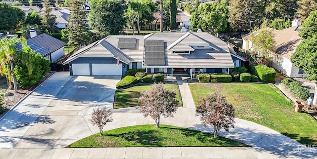 11520 Pinehaven Ave, Bakersfield, CA 93312 - view of front of property with concrete driveway, a tile roof, an attached garage, a front yard, and solar panels