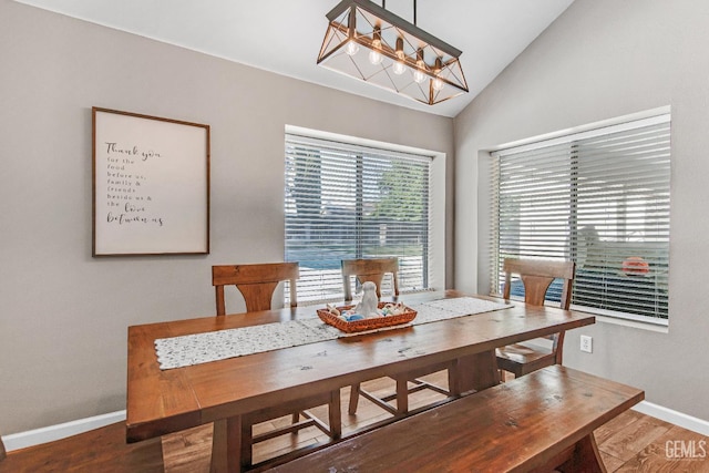 11520 Pinehaven Ave, Bakersfield, CA 93312 - dining space featuring vaulted ceiling, baseboards, wood finished floors, and a chandelier