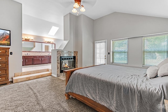 11520 Pinehaven Ave, Bakersfield, CA 93312 - bedroom with a skylight, carpet, lofted ceiling, a fireplace, and a ceiling fan