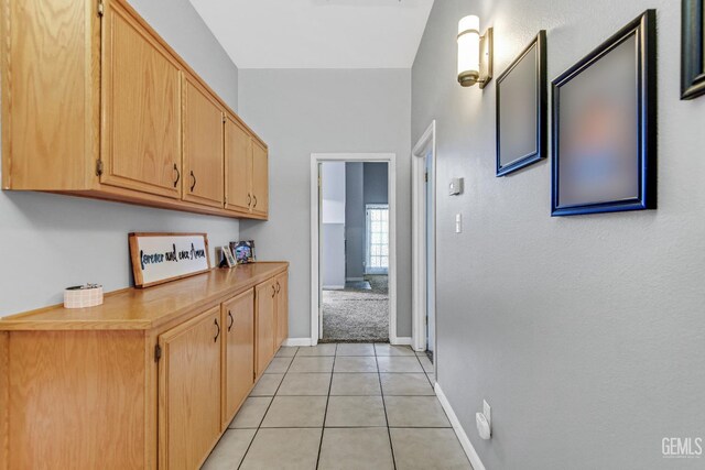 11520 Pinehaven Ave, Bakersfield, CA 93312 - corridor with light tile patterned flooring and baseboards