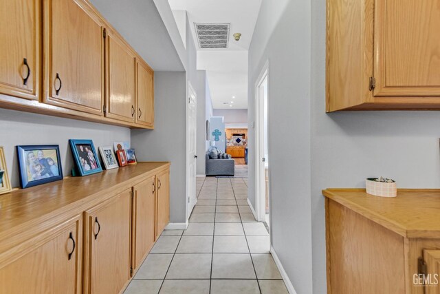 11520 Pinehaven Ave, Bakersfield, CA 93312 - hallway with light tile patterned floors and baseboards