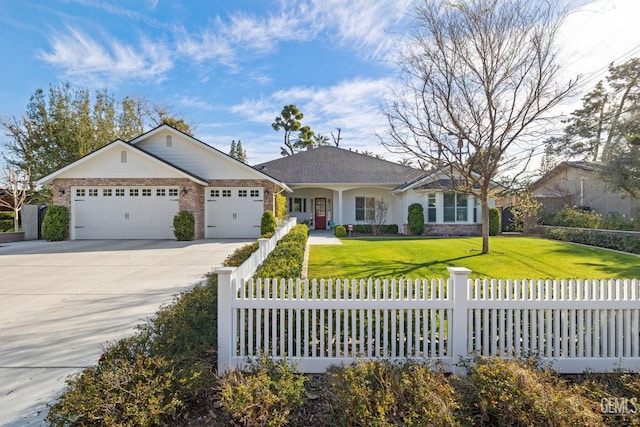 single story home with a front lawn, a fenced front yard, concrete driveway, brick siding, and an attached garage