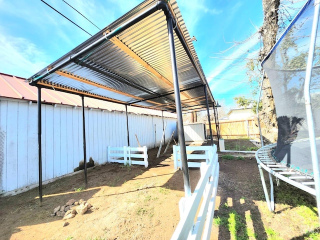 209 Bedford Way, Bakersfield, CA 93308 - view of yard featuring an exterior structure, an outdoor structure, and a trampoline