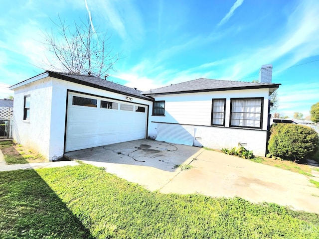 209 Bedford Way, Bakersfield, CA 93308 - view of front of house with stucco siding, a chimney, a garage, an outdoor structure, and driveway