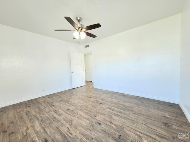 209 Bedford Way, Bakersfield, CA 93308 - unfurnished room featuring visible vents, a ceiling fan, baseboards, and wood finished floors