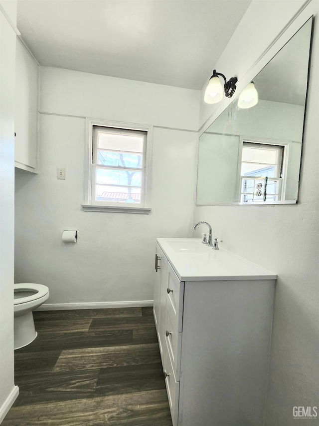 209 Bedford Way, Bakersfield, CA 93308 - bathroom featuring vanity, toilet, wood finished floors, and baseboards