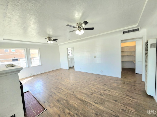 209 Bedford Way, Bakersfield, CA 93308 - unfurnished living room with a textured ceiling, wood finished floors, visible vents, and ceiling fan