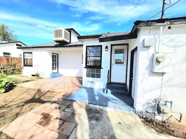 209 Bedford Way, Bakersfield, CA 93308 - exterior space with central air condition unit, stucco siding, entry steps, fence, and a patio area