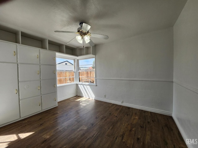 209 Bedford Way, Bakersfield, CA 93308 - unfurnished bedroom featuring a textured ceiling, baseboards, and wood finished floors