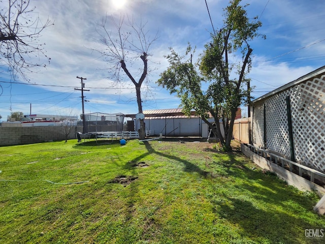 209 Bedford Way, Bakersfield, CA 93308 - view of yard with a trampoline and a fenced backyard