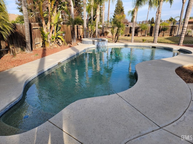 view of swimming pool featuring an in ground hot tub