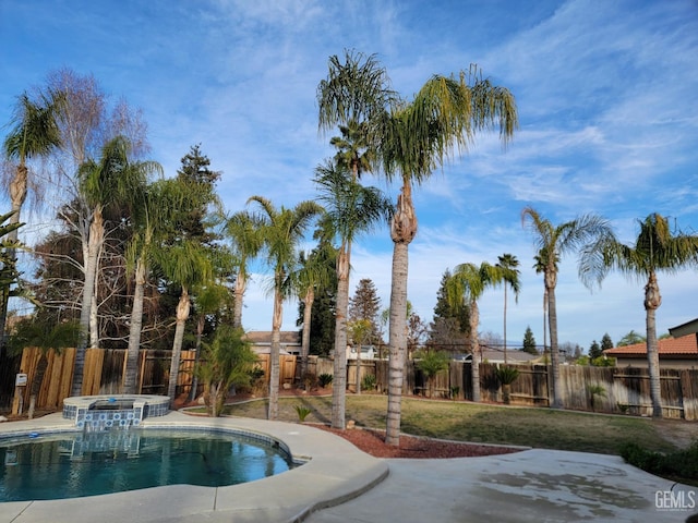 view of pool featuring an in ground hot tub