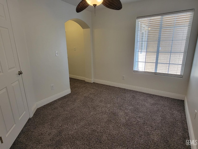 carpeted empty room with ceiling fan