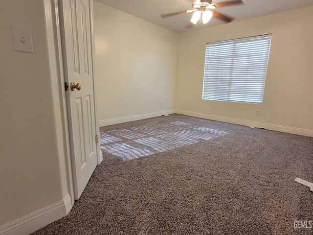 unfurnished room with carpet floors and ceiling fan