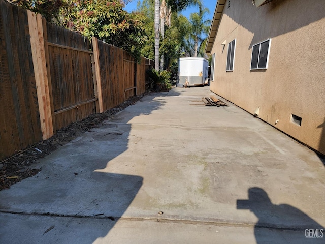 view of side of property featuring a patio area