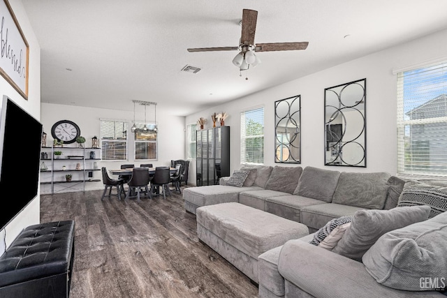 5906 Commonwealth Ave, Bakersfield, CA 93313 - living room with dark wood-style floors, ceiling fan, and healthy amount of natural light