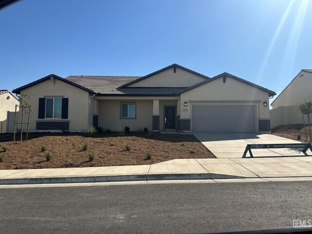 ranch-style house featuring a garage