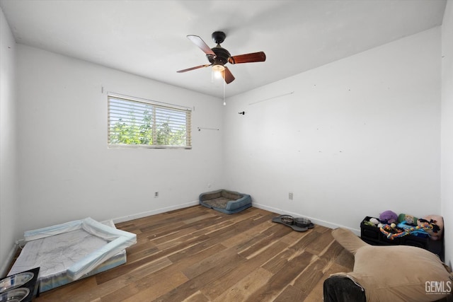 2716 Bladen St, Bakersfield, CA 93309 - empty room with wood finished floors, a ceiling fan, and baseboards