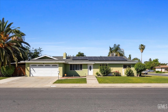 2716 Bladen St, Bakersfield, CA 93309 - ranch-style home featuring a garage, solar panels, driveway, and stucco siding