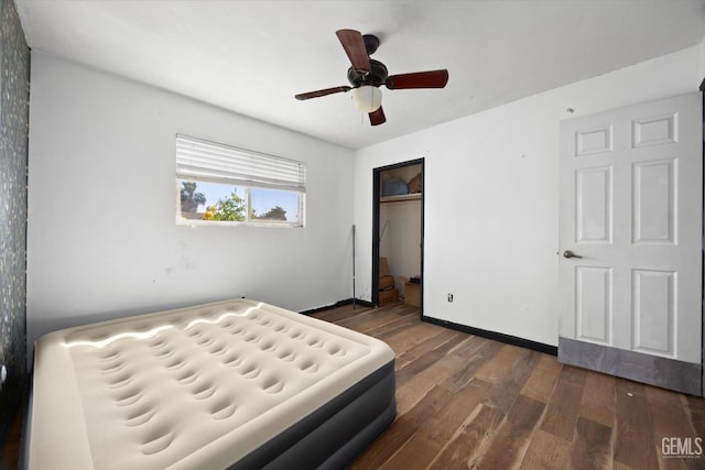 2716 Bladen St, Bakersfield, CA 93309 - unfurnished bedroom with dark wood-style floors, a closet, ceiling fan, and baseboards