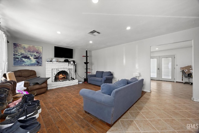 2716 Bladen St, Bakersfield, CA 93309 - living room featuring recessed lighting, a brick fireplace, and french doors