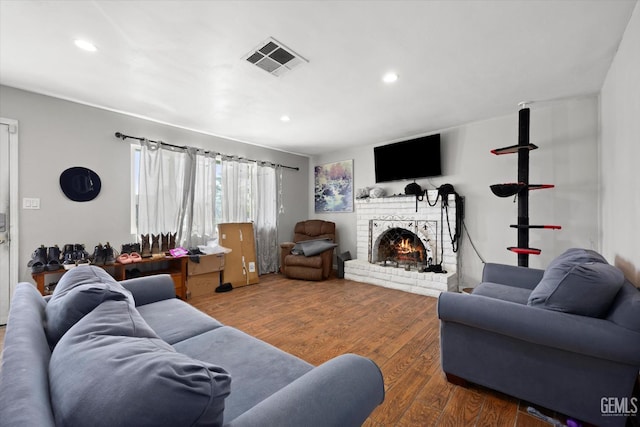 2716 Bladen St, Bakersfield, CA 93309 - living room with recessed lighting, a brick fireplace, and wood finished floors
