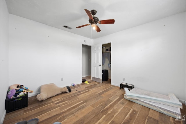 2716 Bladen St, Bakersfield, CA 93309 - unfurnished bedroom featuring wood finished floors, baseboards, a closet, and ceiling fan