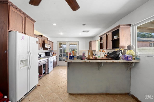 2716 Bladen St, Bakersfield, CA 93309 - kitchen featuring white appliances, backsplash, a peninsula, ceiling fan, and premium range hood
