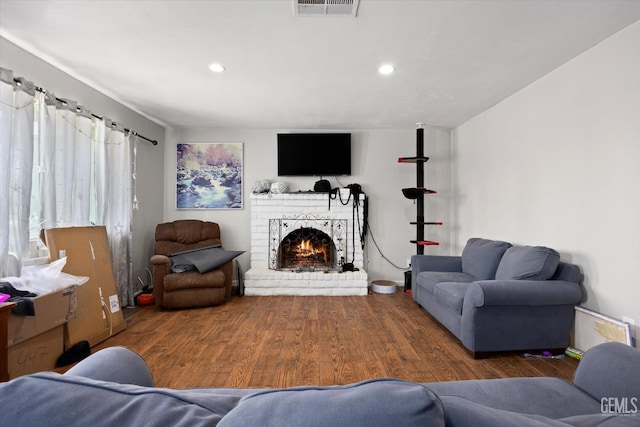 2716 Bladen St, Bakersfield, CA 93309 - living area with wood finished floors, a fireplace, and recessed lighting