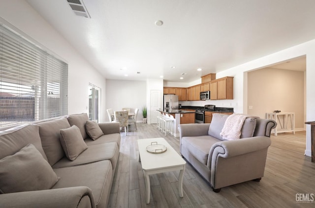 5812 Turquoise Ridge Dr, Bakersfield, CA 93313 - living room featuring light wood-style floors and recessed lighting