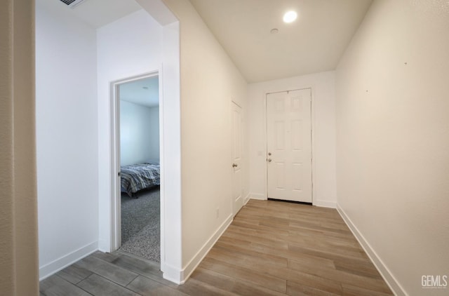 5812 Turquoise Ridge Dr, Bakersfield, CA 93313 - corridor with wood finished floors and baseboards