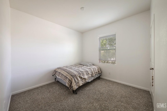 5812 Turquoise Ridge Dr, Bakersfield, CA 93313 - carpeted bedroom featuring baseboards