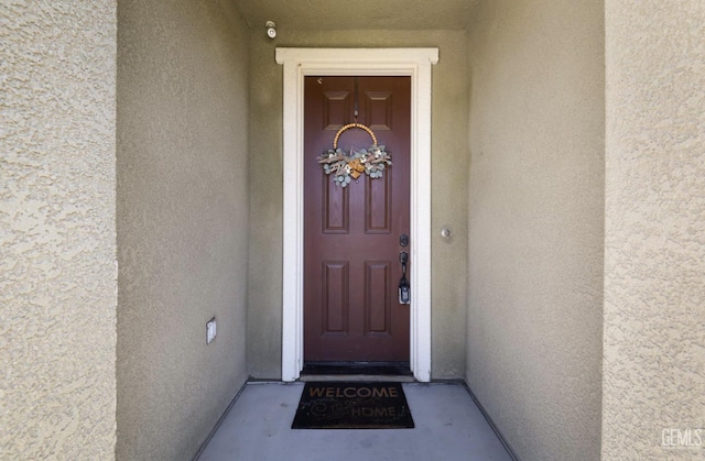 5812 Turquoise Ridge Dr, Bakersfield, CA 93313 - doorway to property with stucco siding