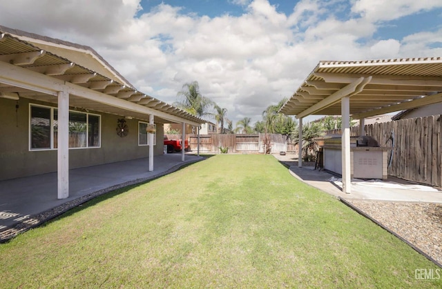 5812 Turquoise Ridge Dr, Bakersfield, CA 93313 - fenced backyard with a patio area