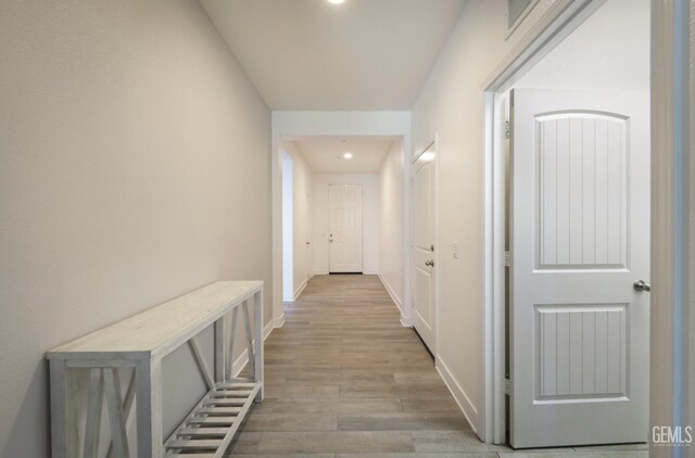 5812 Turquoise Ridge Dr, Bakersfield, CA 93313 - corridor with light wood finished floors and recessed lighting