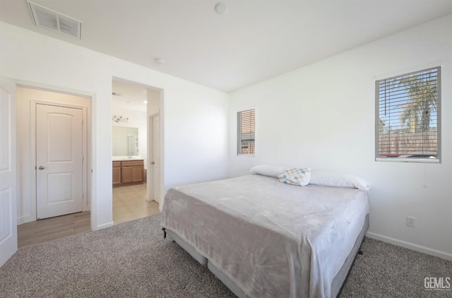 5812 Turquoise Ridge Dr, Bakersfield, CA 93313 - bedroom with light carpet and ensuite bathroom