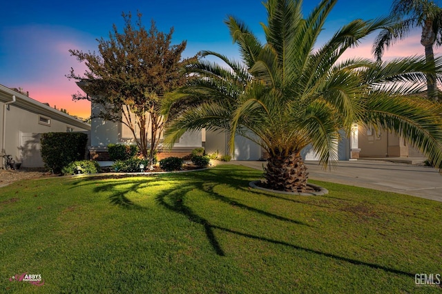 view of front of home featuring a lawn