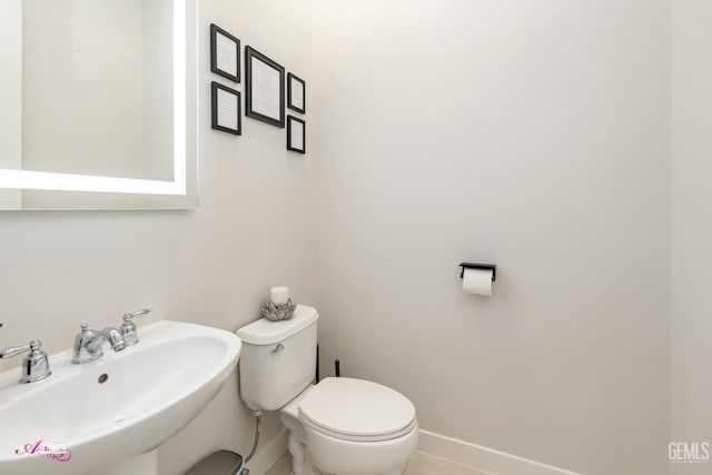 bathroom with toilet and sink